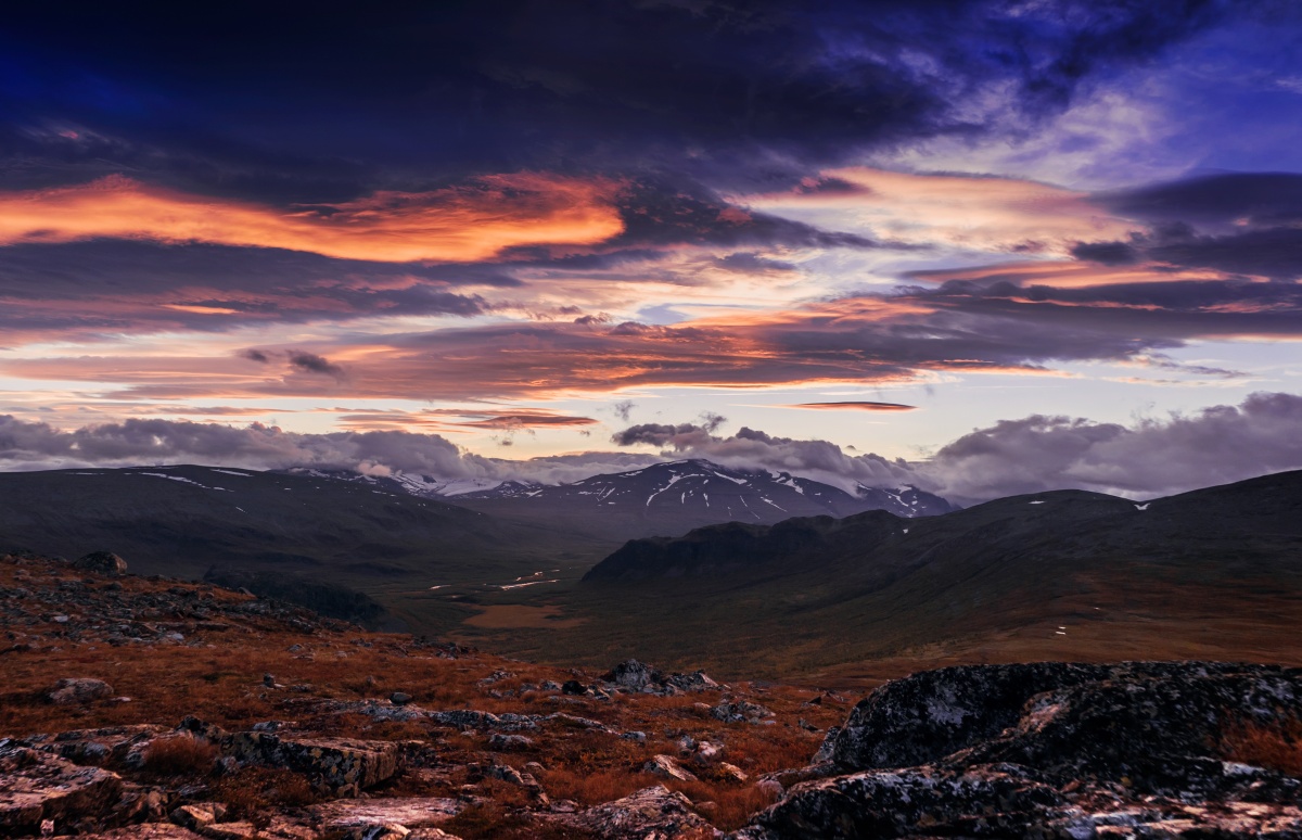 Photo of sunset over river valley in Sarek National Park.