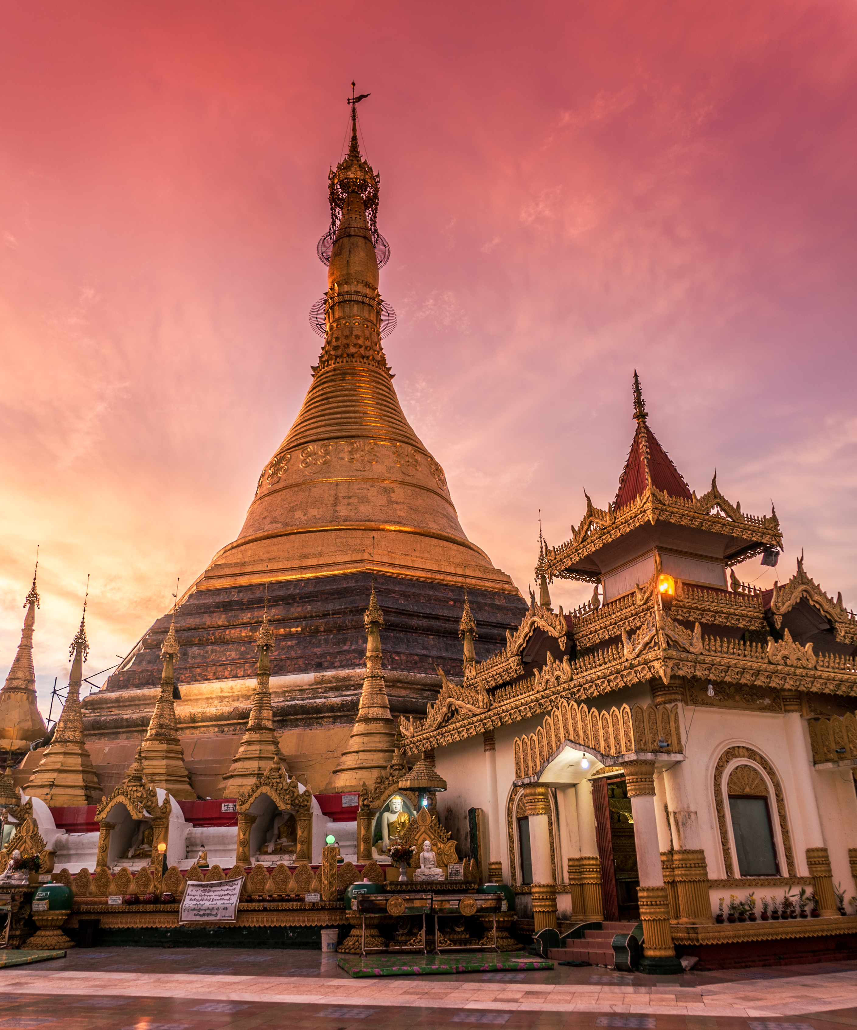 Photo of pink sunset over Buddhist temple