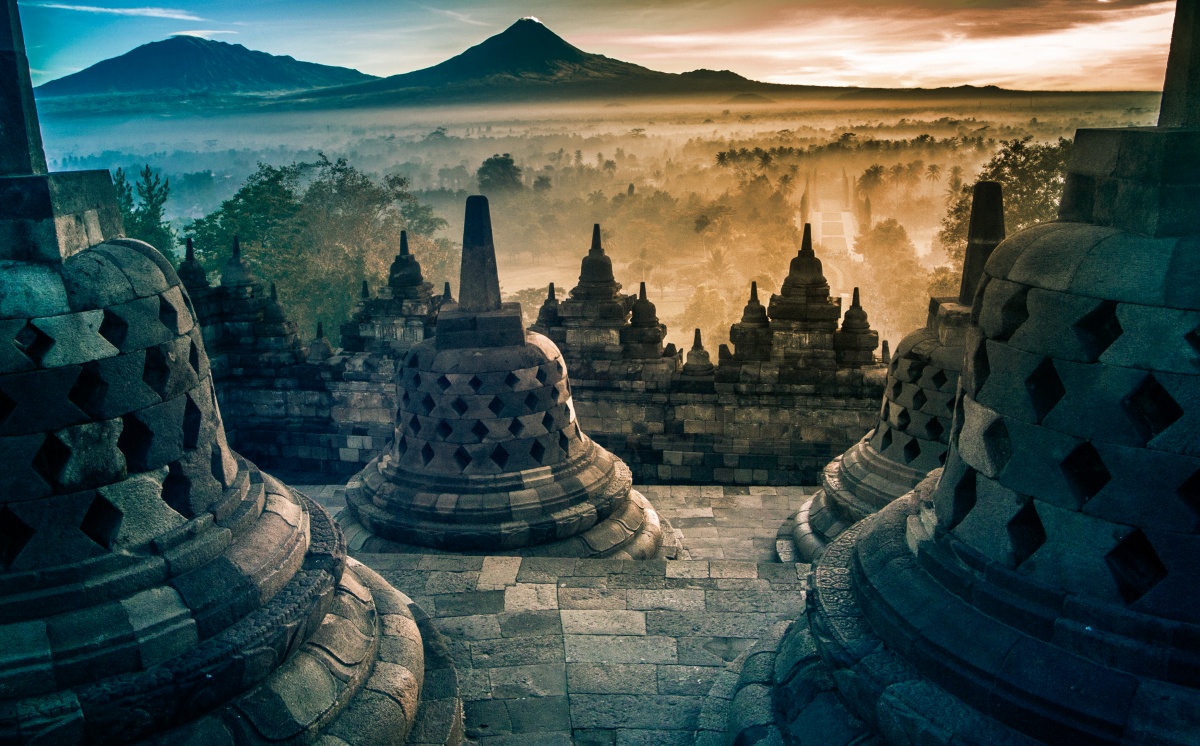 Amazing view from top of Borobudur to misty valley and volcanos on sunrise