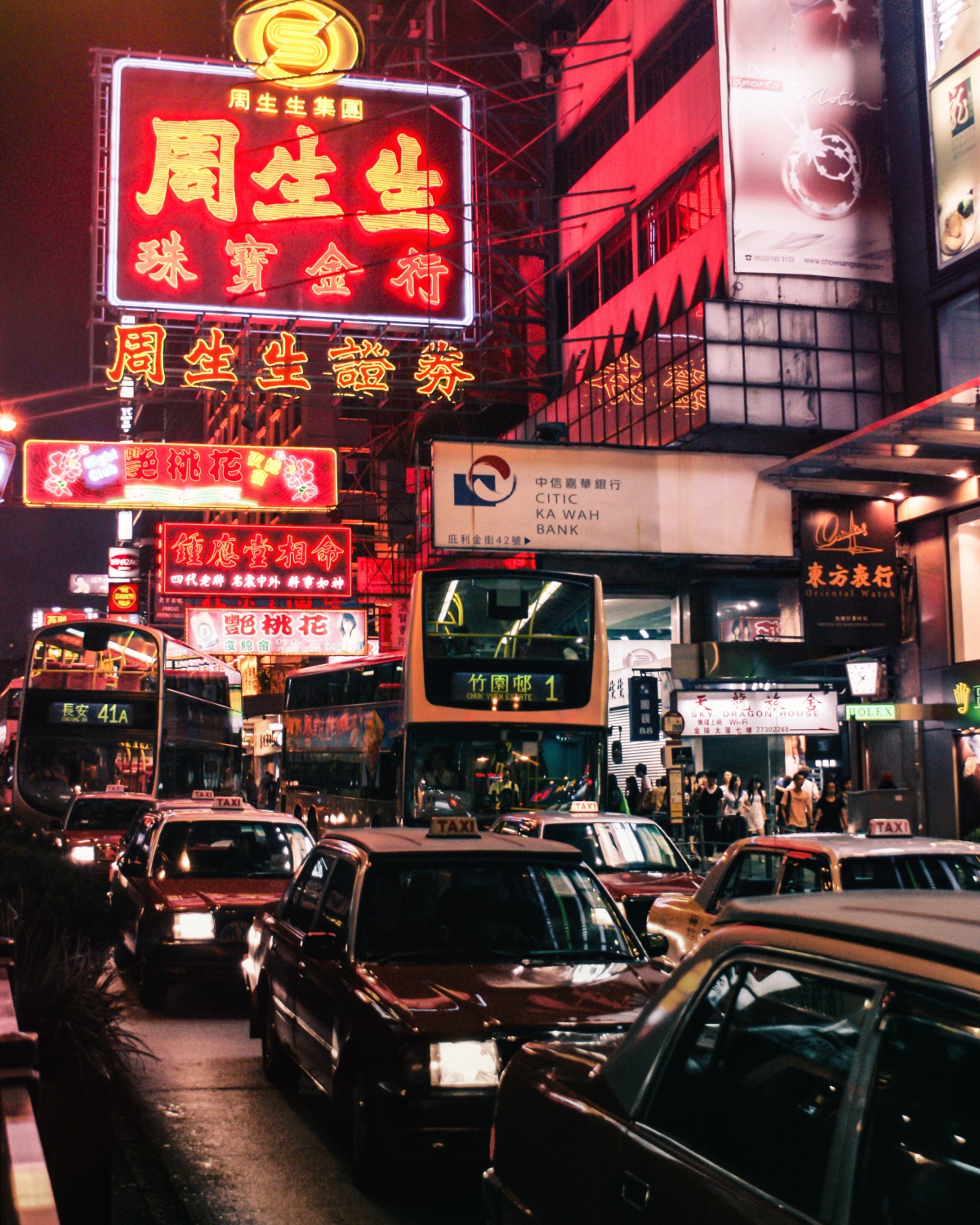 Photo of neon light and traffic rush in Hong Kong, Nathan Road, Kowloon.