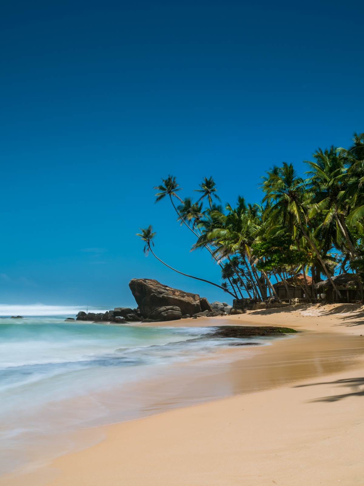 Long exposure photo of beautiful beach paradise in Mihiripenna, Sri Lanka.