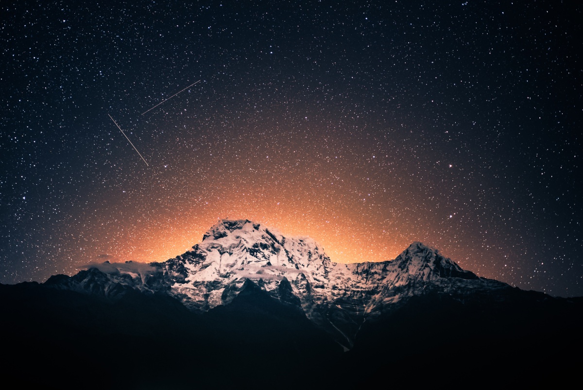 Photo of a starry sky over Annapurna mountain range near Pokhara in Nepal