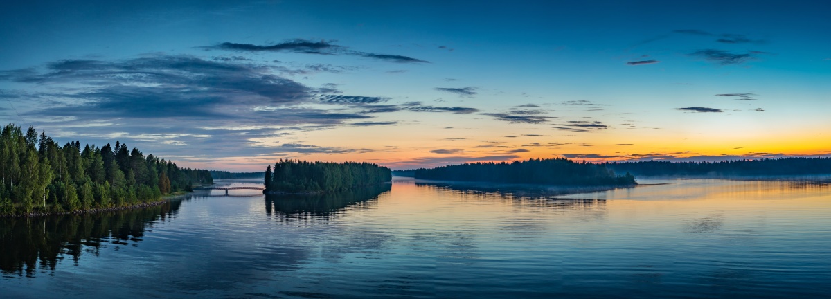 Sunset over Vaala bridge misty summer morning